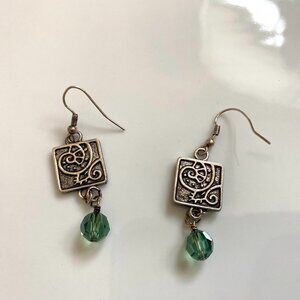 NWOT Beach inspired nautilus silver earrings with green swarovski crystal drop.